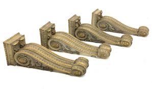 * Two pairs of early Victorian parcel-gilt and white painted architectural brackets each formed as