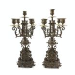 Pair of ornate brass five branch candelabra,