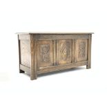 Medium oak blanket box with carved detail,