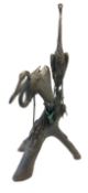 Very large hollow cast bronze garden statue of two herons upon a log, with hand applied patina,