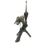 Very large hollow cast bronze garden statue of two herons upon a log, with hand applied patina,