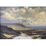 John H Capstick (British 20th century): Mallards in Flight over a Moorland,