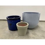 Graduated set of four glazed terracotta egg cup planters, (W39cm) and four other similar plant pots,