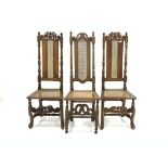 Pair of Charles II beech framed hall chairs, carved cresting rail, cane panel seat and back,