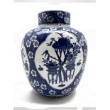 19th Century Chinese vase and cover decorated in blue and white with panels of precious things and