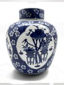 19th Century Chinese vase and cover decorated in blue and white with panels of precious things and