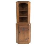 Gnome man Yorkshire oak corner cupboard, with lunette carved frieze over two open shelves,