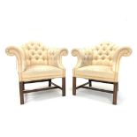 Pair of mahogany framed armchairs in the George III style, upholstered in deep buttoned cream silk,