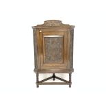 Victorian deign oak corner cupboard, with panelled floral scroll carved door enclosing two shelves,