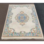 Indian Ivory ground carpet, floral medallion on ivory field, pastel blue boarder,