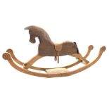 20th century carved pine rocking horse, with leather saddle and stirrups,