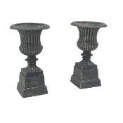 Pair bronze finish urns on square base, W28cm, H50cm,