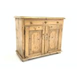 Victorian pine cupboard, with one long drawer above two panelled doors, raised on block supports,