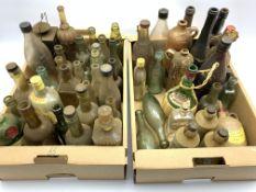 Various glass and stoneware bottles including three stoneware bottles 'W.