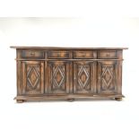 Large continental oak sideboard fitted with four drawers and cupboards,