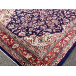 Persian Kashan ground rug, floral medallion on blue field with all over trailing foliate,