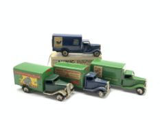 Four Tri-ang Minic clockwork tin-plate delivery vans - Carter Paterson, Southern Railway,