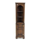 Titchmarsh and Goodwin - Small oak floor standing corner cupboard,