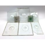 Eight late 19th Century blown bullseye glass panels, of various sizes, the largest 34cm x 29cm,