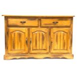 20th century light oak sideboard, with two drawers above two panelled cupboards,