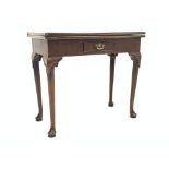 Georgian mahogany fold over tea table, with frieze drawer, raised on carved cabriole supports,