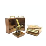 19th Century brass microscope in a fitted mahogany case,