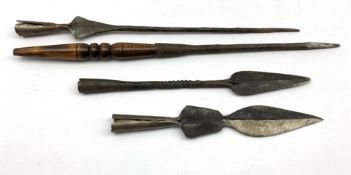 Four native hand made iron spear heads, various sizes and designs,