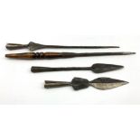 Four native hand made iron spear heads, various sizes and designs,