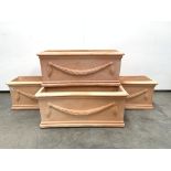 Set four trough shaped terracotta planters decorated with floral swags,