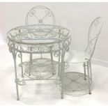 White painted wrought metal garden table, (D76cm) and two matching chairs,