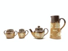 Four pieces of Royal Doulton salt glazed stoneware with harvest scene decoration,
