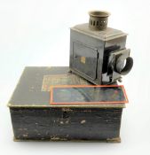 A boxed German made Magic Lantern with brass plaque E.P.