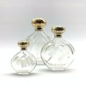 Set of three Nina Ricci 'L'Air du Temps' graduated glass perfume flasks designed by Lalique largest