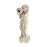 Crazed porcelain figural statue of a semi-nude lady with jug,