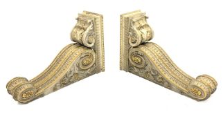* Pair of early Victorian parcel-gilt and white painted architectural brackets formed as two