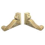 * Pair of early Victorian parcel-gilt and white painted architectural brackets formed as two