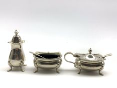 Silver three piece condiment set and two spoons with glass liners and gadrooned borders Birmingham