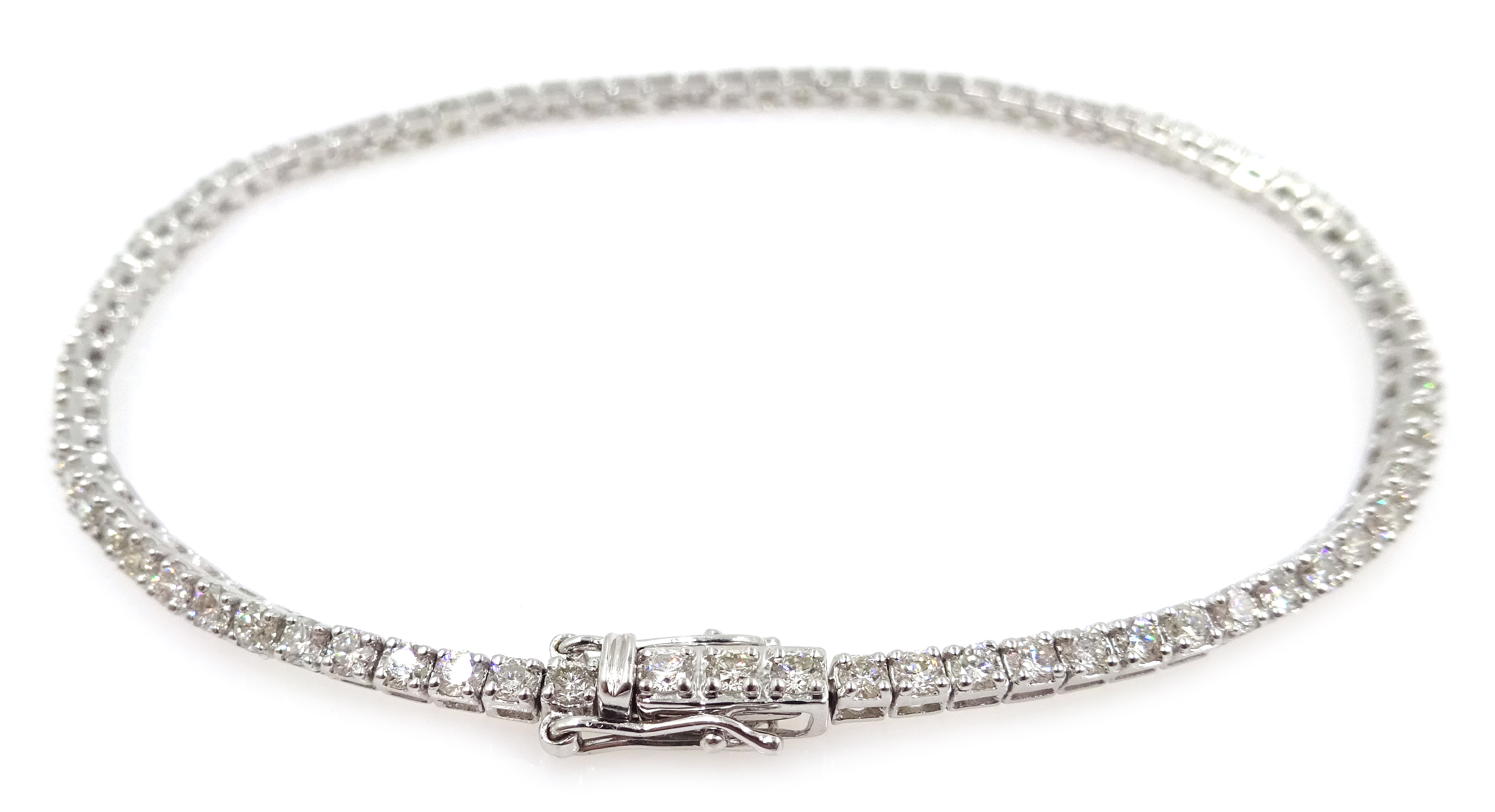 White gold round brilliant cut diamond line bracelet, stamped 18K, diamond total weight approx 2.