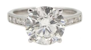 18ct white gold single stone diamond ring, with diamond set shoulders, hallmarked,