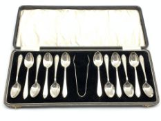 Set of twelve silver teaspoons and sugar tongs with pointed finials Birmingham 1929 Maker Arthur