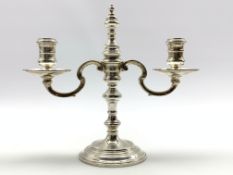 Georgian design silver two branch candelabrum with baluster knop stem and circular foot H20cm