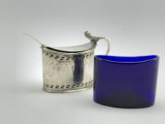 George III silver oval mustard pot, the hinged cover engraved with an initial, blue glass liner,