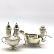 Silver three piece condiment set of panel sided design Sheffield 1936/7 and a silver sauce boat and