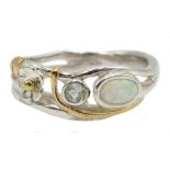 Silver and gold highlights opal and topaz ring,
