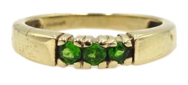 9ct gold three stone green garnet ring,