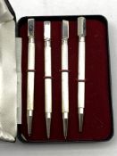 Set of four Sterling silver propelling Bridge pencils,