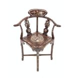 20th century hardwood oriental corner chair, with pierced and carved splats, swept arms, panel seat,