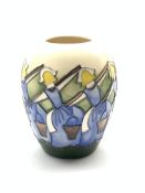 Moorcroft vase decorated in the 'Eight Maids a Milking' pattern from the twelve days of Christmas