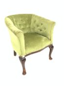 19th century mahogany tub shaped arm chair, upholstered in buttoned green velvet,