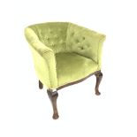 19th century mahogany tub shaped arm chair, upholstered in buttoned green velvet,